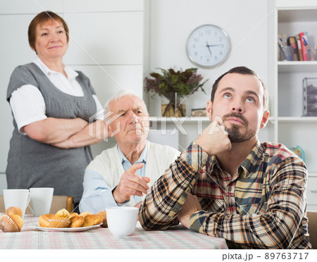 Parents arguing with son 89763717