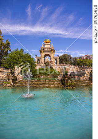 Barcelona, Spain - September 20, 2021: View of the fountain from Parc de la Ciutadella. A small lake, museums, and a large fountain designed by Josep Fontsere. The grounds include the city zoo Barcelona, Spain - September 20, 2021: View of the fountain from Parc de la Ciutadella. A small lake, museums, and a large fountain designed by Josep Fontsere. The grounds include the city zoo 89766628