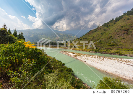 The Punakha Suspension Bridge at the Punakha Dzong. Across the Tsang Chu River to Shengana and Wangkha village. The longest suspension bridge in Bhutan and always decorated with colorful prayer flags. The Punakha Suspension Bridge at the Punakha Dzong. Across the Tsang Chu River to Shengana and Wangkha village. The longest suspension bridge in Bhutan and always decorated with colorful prayer flags. 89767266