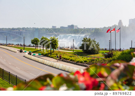 Niagara Falls, Canada - August 26, 2021: Massive us side of the Niagara Falls, a group of three waterfalls at the southern end of Niagara Gorge, spanning the border between Canada and United States 89769822