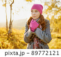 Young woman walking in the fall season. Autumn outdoor portrait 89772121