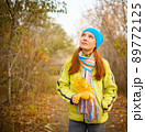 Young woman walking in the fall season. Autumn outdoor portrait 89772125