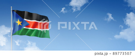 South Sudan flag isolated on a blue sky. Horizontal banner 89773507