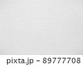 Sheet of white paper. Background with paper texture. Close-up top view. 89777708