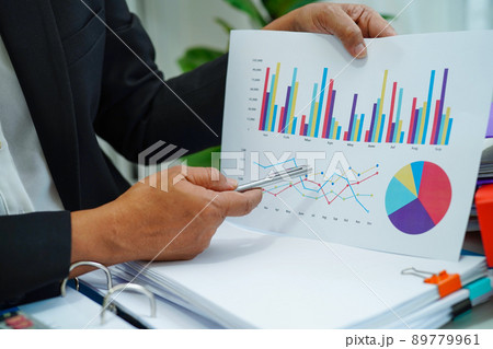 Businessman working and analysis with statistic graph in office. 89779961