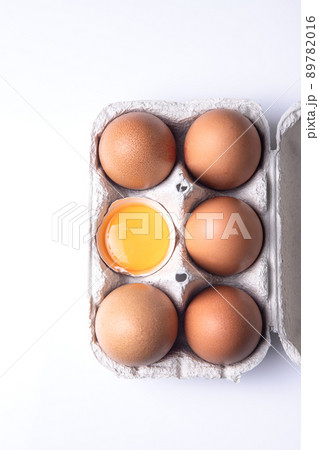 Top view of brown eggs on egg carton isolated on white background. 89782016