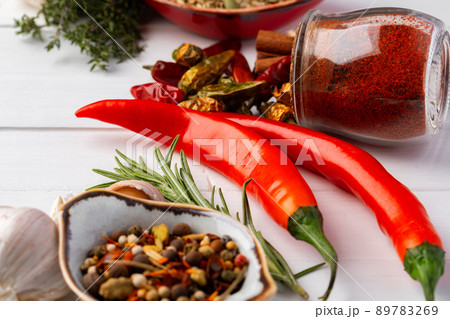 Flat lay composition with chili peppers and spices Flat lay composition with chili peppers and spices 89783269