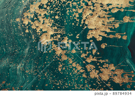 Fluid Art acrylic paints. Abstract mixing green paint waves. Liquid golden flows splashes. Marble effect background or texture 89784934