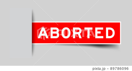Inserted red color label sticker with word aborted on gray background 89786096
