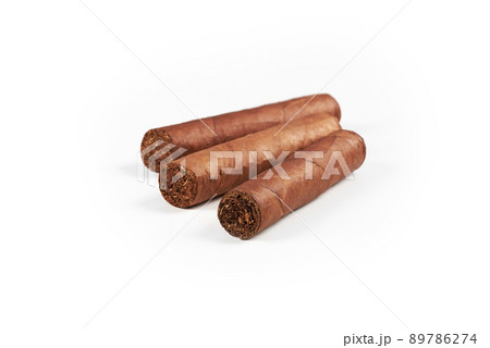 Three Cuban cigars isolated on a white background Three Cuban cigars isolated on a white background 89786274