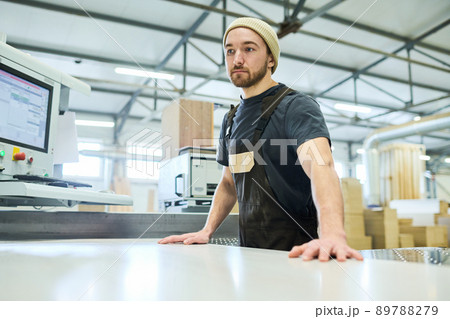 Carpenter doing wood work at factory 89788279