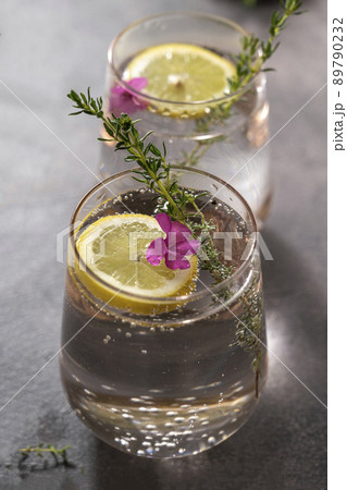 Refreshing iced infused detox drink with lemon and fresh rosemary, summer drink. Healthy lifestyle, copy space Refreshing iced infused detox drink with lemon and fresh rosemary, summer drink. Healthy lifestyle, copy space 89790232