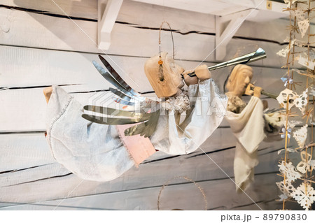Angel with trumpet or horn announcing the Good News. Home decoration, toy. Front view. Angel with trumpet or horn announcing the Good News. Home decoration, toy. Front view. 89790830