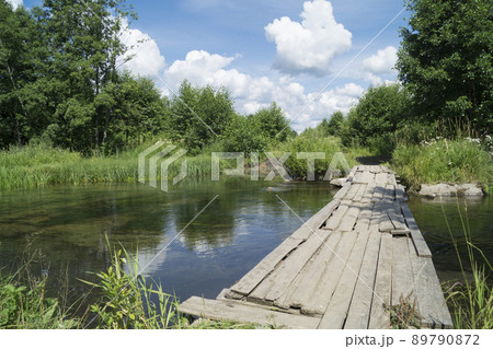 Year landscape with timber stream on background blue sky 89790872