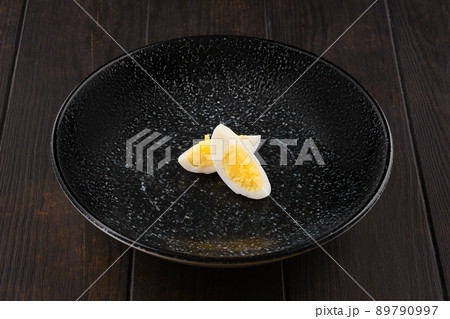 Half of boiled egg cut on two pieces Half of boiled egg cut on two pieces 89790997