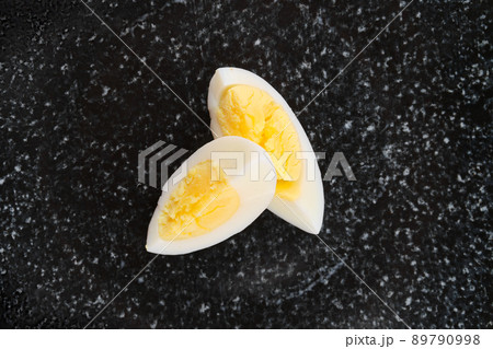 Overhead view of half of boiled egg cut on two pieces 89790998