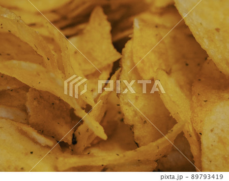 Spiced potato chips, a close-up shot. Fried potatoes. Spiced potato chips, a close-up shot. Fried potatoes. 89793419