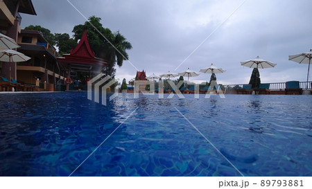 Raindrops fall on the water in the pool. Raindrops fall on the water in the pool. 89793881