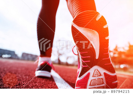 Sport running woman exercise. Runner feet running on road closeup on shoe. Run female workout exercise. Sport and healthy lifestyle. Sport running woman exercise. Runner feet running on road closeup on shoe. Run female workout exercise. Sport and healthy lifestyle. 89794215