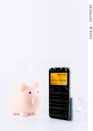 E banking concept. Mobile phone with internet online bank app. Pig bank with credit card on white background. Online wallet save money. 89794292