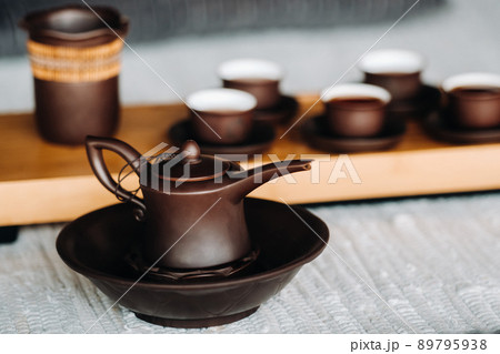 Preparing for a tea ceremony with a large company Preparing for a tea ceremony with a large company 89795938