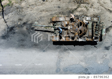 Kyiv region, Ukraine - May 15, 2022: War in Ukraine. Highway Kyiv - Zhytomyr. People take selfies against destroyed russian tank after russian atack in Febrary. 89796362