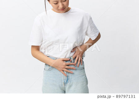 Pregnancy lost. Abortion high. Suffering tormented tanned beautiful young Asian woman hold hands on stomach posing isolated on white background. Injuries Poor health Illness concept. Cool offer Pregnancy lost. Abortion high. Suffering tormented tanned beautiful young Asian woman hold hands on stomach posing isolated on white background. Injuries Poor health Illness concept. Cool offer 89797131