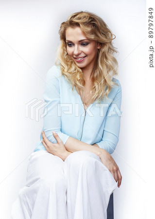 young pretty stylish blond girl posing emotional isolated on white background happy smiling cool smile, lifestyle people concept close up 89797849