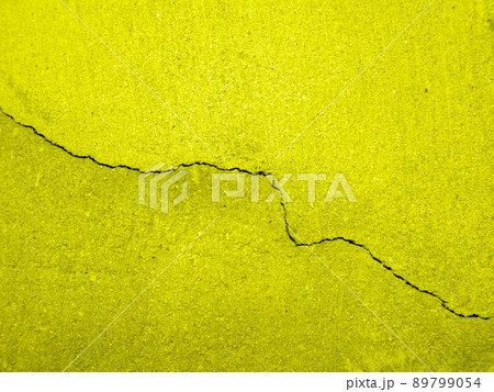 yellow cracked wall background 89799054