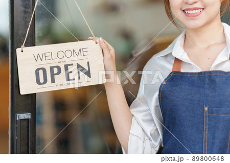 Asian Barista cafe owner smile while cafe open. SME entrepreneur seller business concept. 89800648