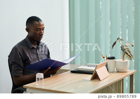 Employee Studying Technical Documentation Employee Studying Technical Documentation 89805789