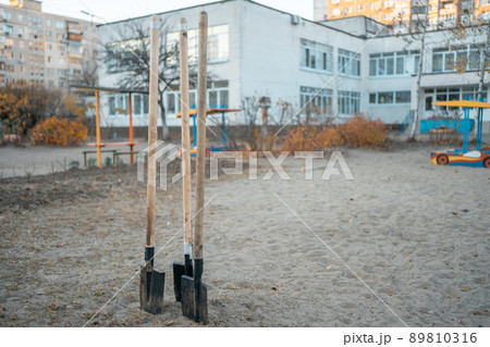 garden shovels in ground for planting young tree in playground outdoor garden shovels in ground for planting young tree in playground outdoor 89810316