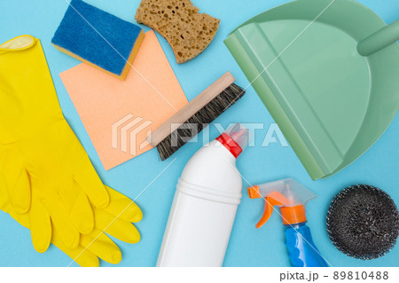 Tools and accessories for cleaning home, kitchen, bathroom and office. Cleaning service. Blue background. Rubber gloves, sponge and spray. Flat lay. Top view. Tools and accessories for cleaning home, kitchen, bathroom and office. Cleaning service. Blue background. Rubber gloves, sponge and spray. Flat lay. Top view. 89810488