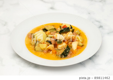 squid with with vegetables and sauce on the plate 89811462