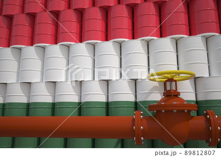 Oil pipe and barrels with painted flag of Hungary. Petroleum industry related 3d rendering 89812807