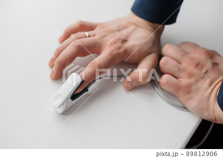 Pulse oximeter on a white background. Medical monitoring and diagnostic device for non-invasive measurement of capillary blood oxygen saturation 89812906