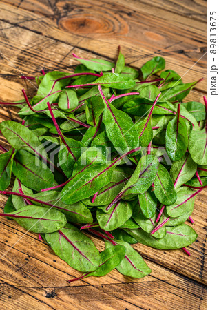 Fresh raw chard leaves, mangold, swiss chard on a wooden kitchen table. Wooden background. Top view 89813675