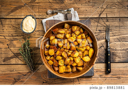 Fried potato - Patatas bravas traditional Spanish potatoes snack tapas. wooden background. Top view 89813881