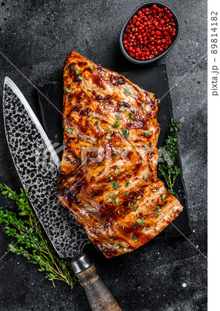 Barbecue pork rack spare ribs on a marble board. Black background. Top view Barbecue pork rack spare ribs on a marble board. Black background. Top view 89814182