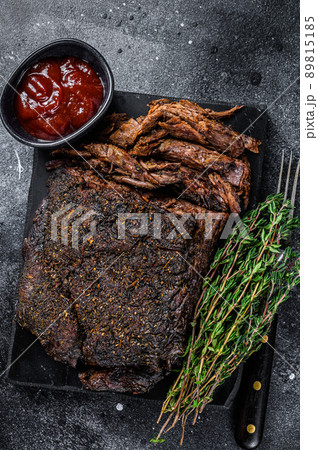 Texas Style BBQ Smoked Beef Brisket meat steak. Black background. Top view Texas Style BBQ Smoked Beef Brisket meat steak. Black background. Top view 89815185