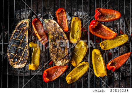 Grilled vegetables on barbecue, outdoor BBQ grill with fire. Top view 89816283