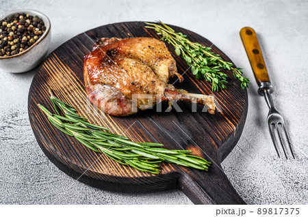 Fried duck confit leg baked poultry meat. White background. top view 89817375