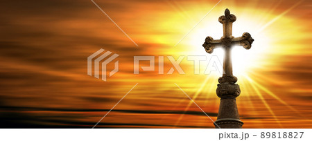 Old Stone Religious Cross against a Beautiful Sunset with Sunbeams Old Stone Religious Cross against a Beautiful Sunset with Sunbeams 89818827