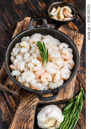 Boiled Peeled Shrimps, Prawns in a pan. Dark Wooden background. top view 89819020