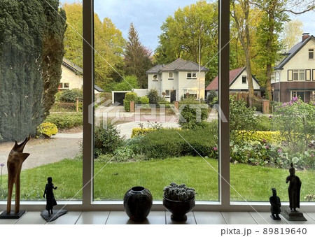 a view from a window on a street in spring 89819640