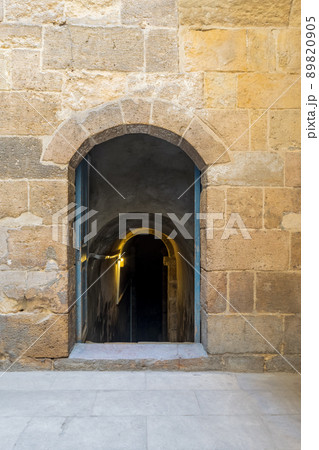 Stone bricks wall with wooden door leading to water cistern lying under El Silahdar complex, Cairo Stone bricks wall with wooden door leading to water cistern lying under El Silahdar complex, Cairo 89820905