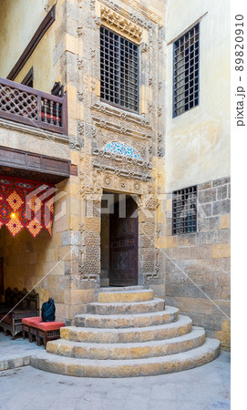 Stone staircase and wooden door leading to old Mamluk era Beit El Sennary building, Cairo, Egypt 89820910