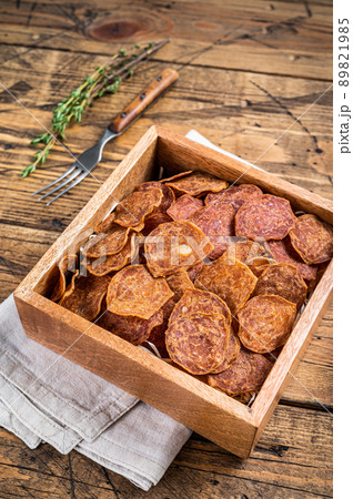 Meat Jerky from beef and pork meat. wooden background. Top view Meat Jerky from beef and pork meat. wooden background. Top view 89821985