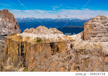 View of Italian Dolomite Mountain in sunny day with snow at Sass Pordoi. View of Italian Dolomite Mountain in sunny day with snow at Sass Pordoi. 89826738
