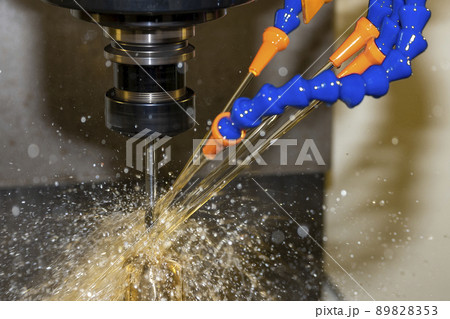 The CNC milling machine cutting the  mold parts with oil coolant method. 89828353